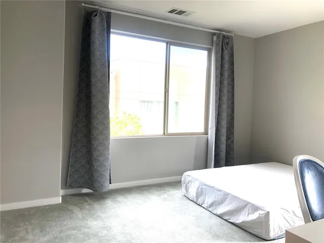 a workspace with furniture and window