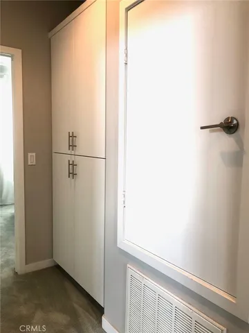 a front view of a house with a yard table and chairs