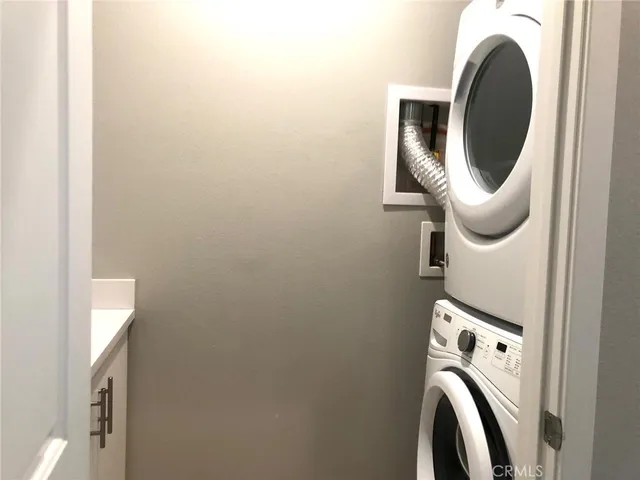 a view of a patio with couches table and chairs with garden and plants