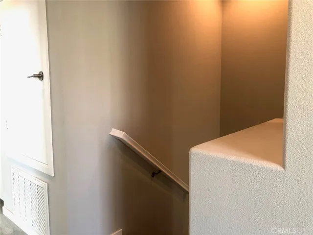 a view of a swimming pool with a patio and a garden