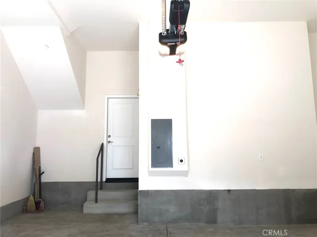 a view of a patio with table and chairs with wooden floor and fence
