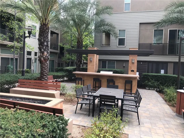 a view of a house with backyard and deck