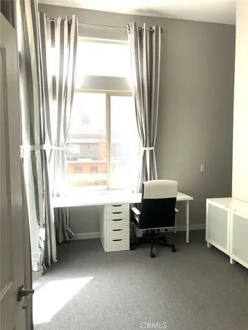 a room with a window and a table