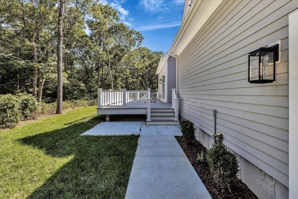 58 Amos Landing Road Mashpee, MA 02649 - Photo 12 of 42 a view of house with backyard