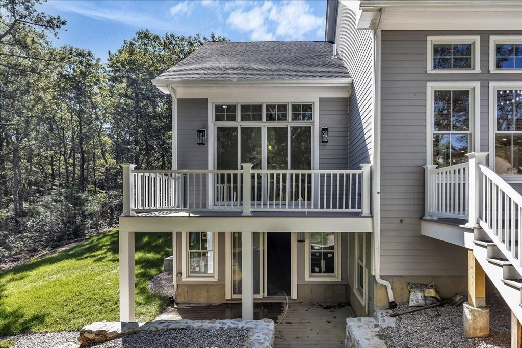 58 Amos Landing Road Mashpee, MA 02649 - Photo 14 of 42 a view of a brick house with a window