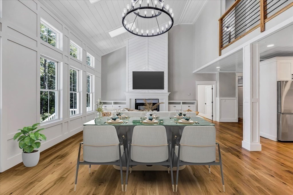 58 Amos Landing Road Mashpee, MA 02649 - Photo 17 of 42 a view of a dining room with furniture window and wooden floor