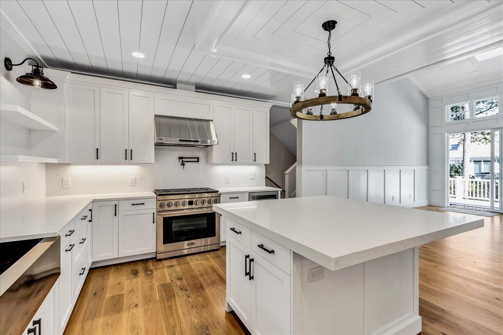 58 Amos Landing Road Mashpee, MA 02649 - Photo 21 of 42 a kitchen with a stove a sink and a refrigerator