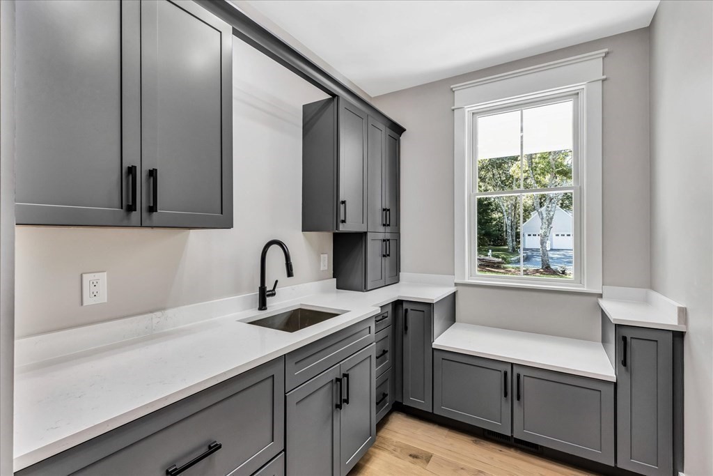 58 Amos Landing Road Mashpee, MA 02649 - Photo 24 of 42 a kitchen with a sink and a window