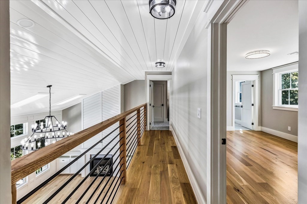 58 Amos Landing Road Mashpee, MA 02649 - Photo 34 of 42 a view of a hallway with wooden floor and staircase