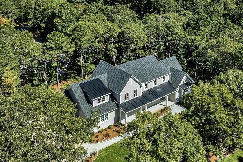 58 Amos Landing Road Mashpee, MA 02649 - Photo 5 of 42 an aerial view of a house with yard and trees