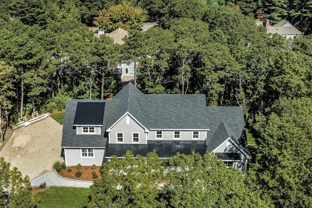 58 Amos Landing Road Mashpee, MA 02649 - Photo 6 of 42 an aerial view of a house with swimming pool and garden
