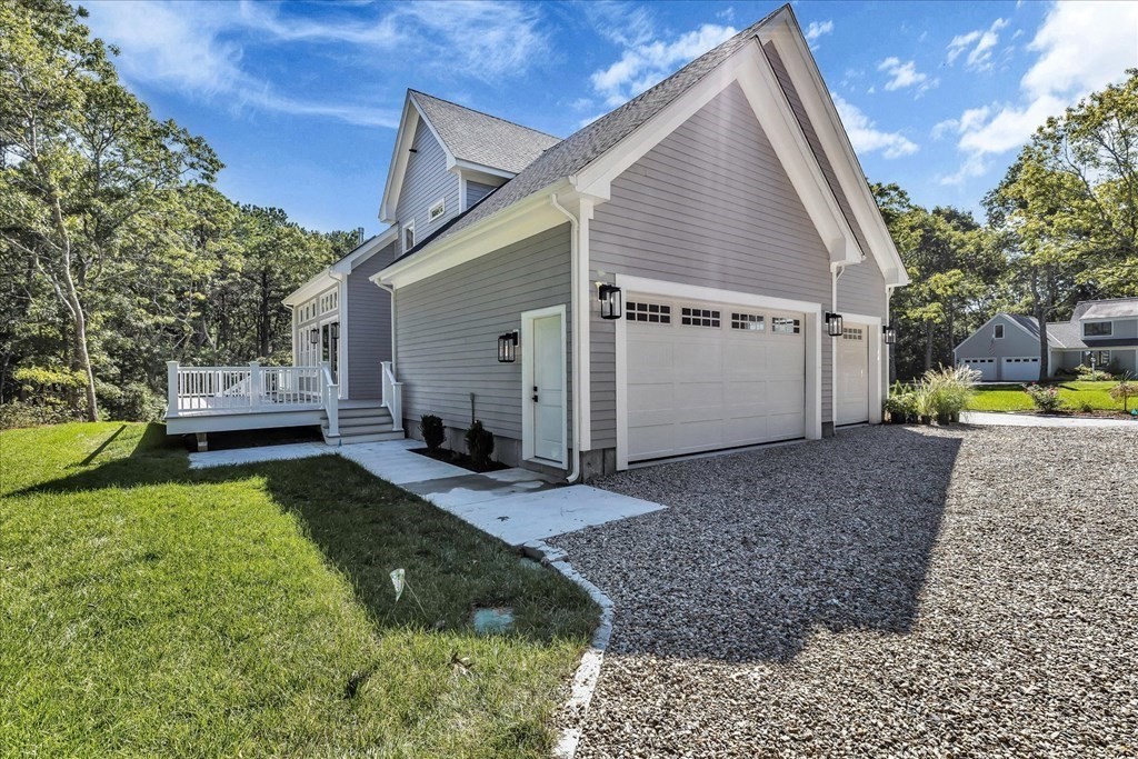 58 Amos Landing Road Mashpee, MA 02649 - Photo 10 of 42 a view of house with backyard
