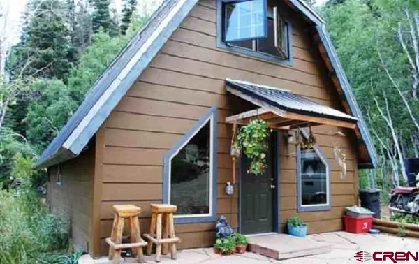 a backyard of a house with seating space