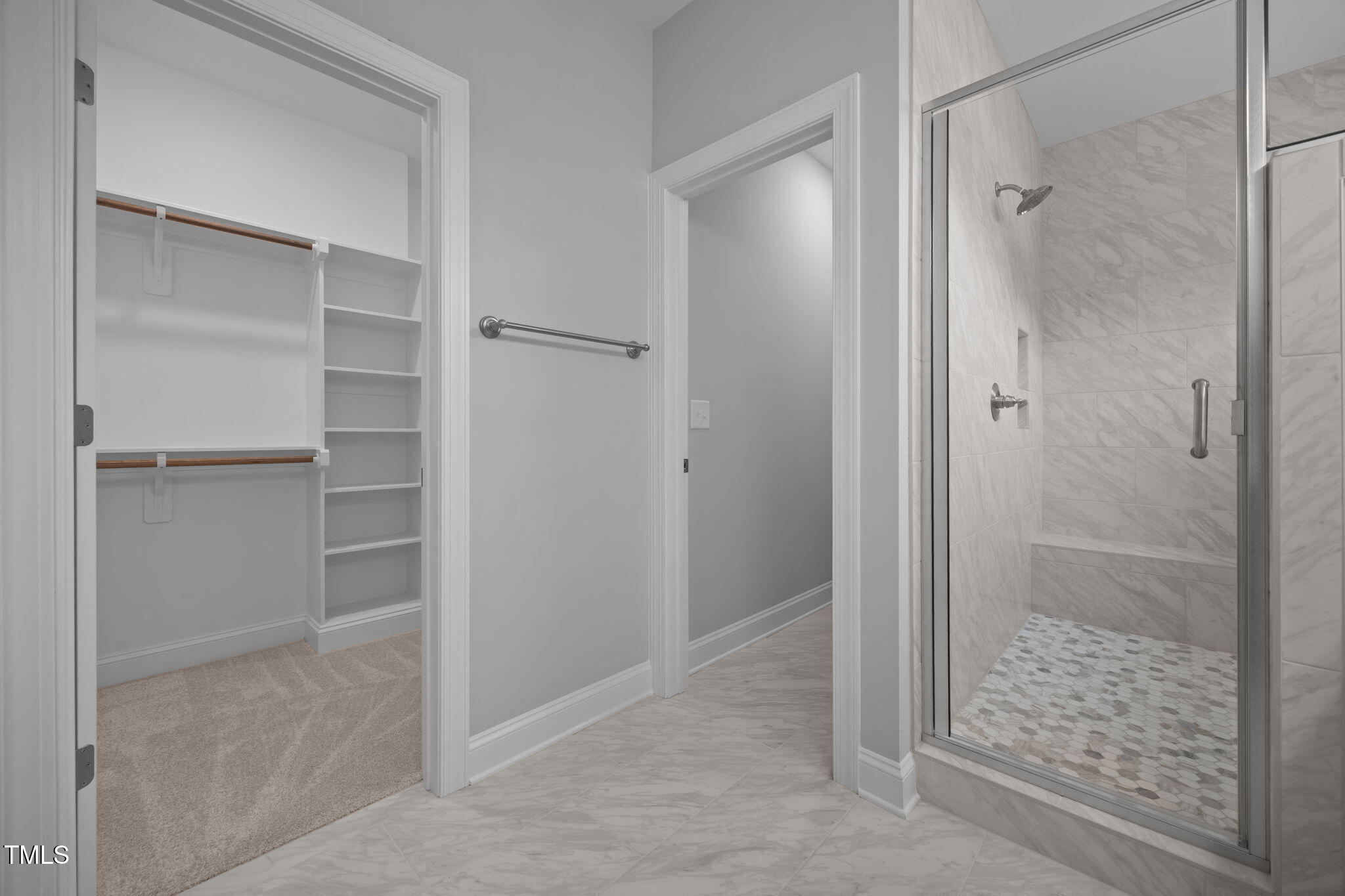 109 Drew Street Louisburg, NC 27549 - Photo 16 of 30 a bathroom with a glass shower door