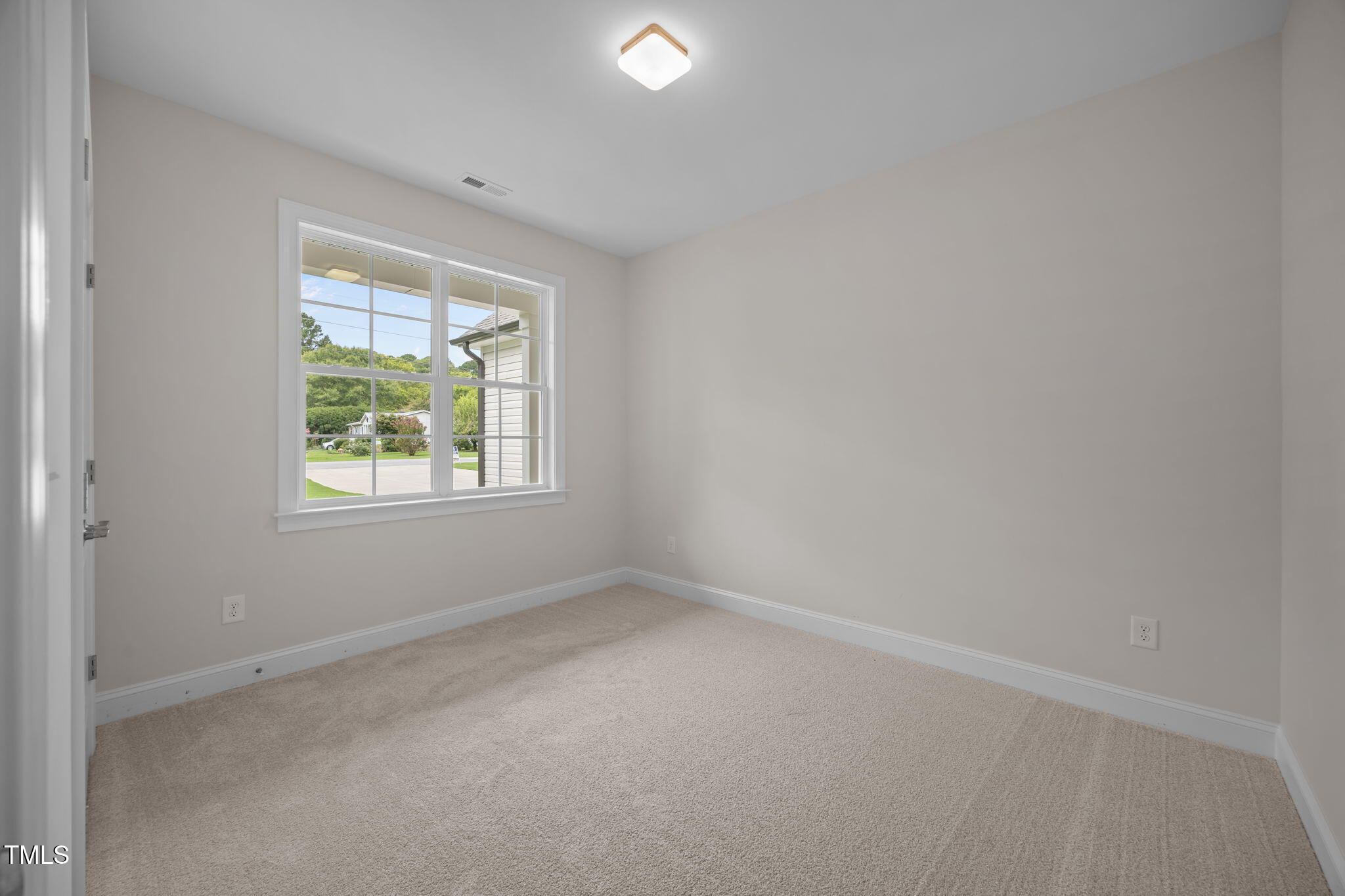 109 Drew Street Louisburg, NC 27549 - Photo 20 of 30 an empty room with windows