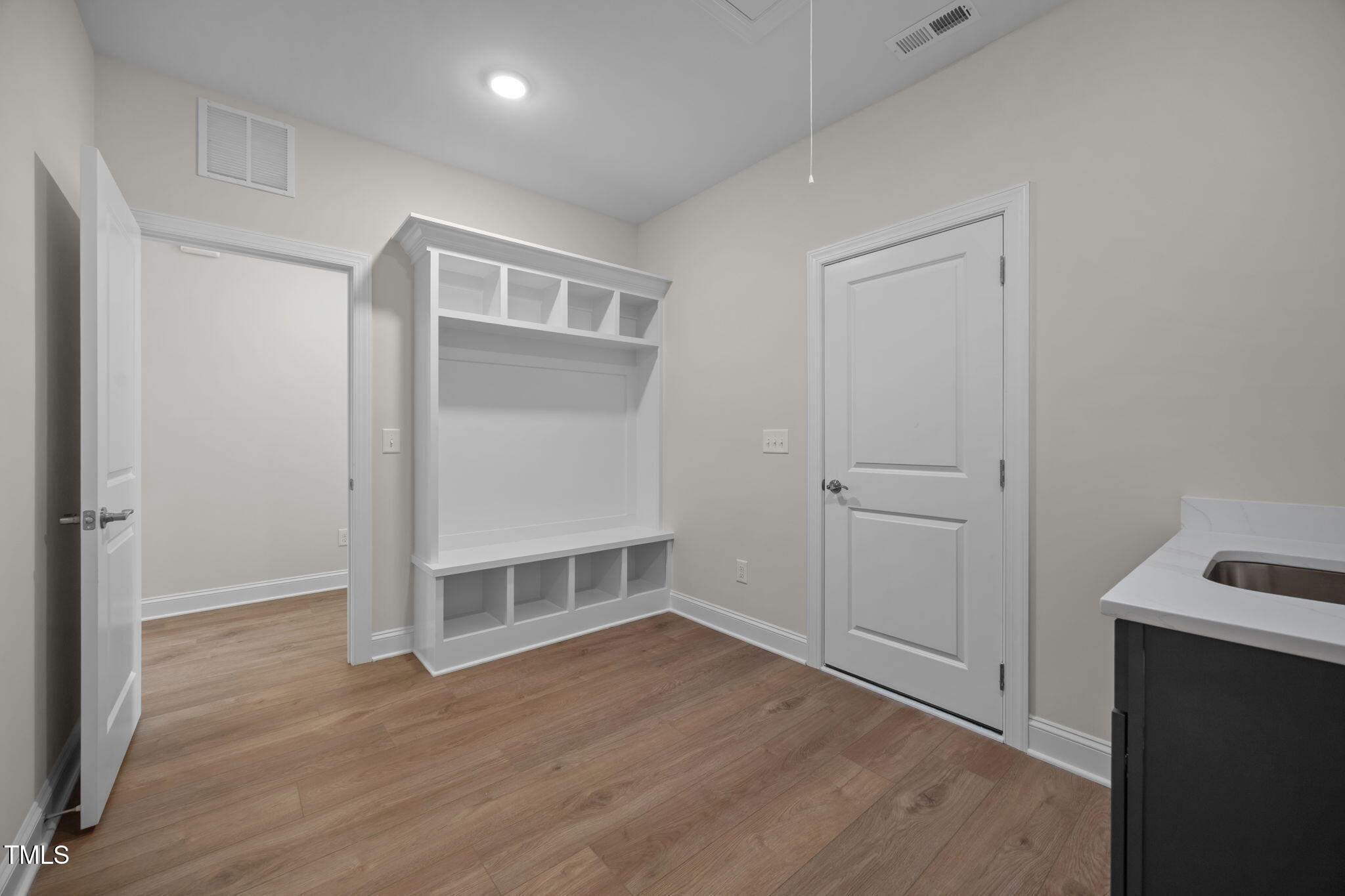 109 Drew Street Louisburg, NC 27549 - Photo 21 of 30 an empty room with wooden floor