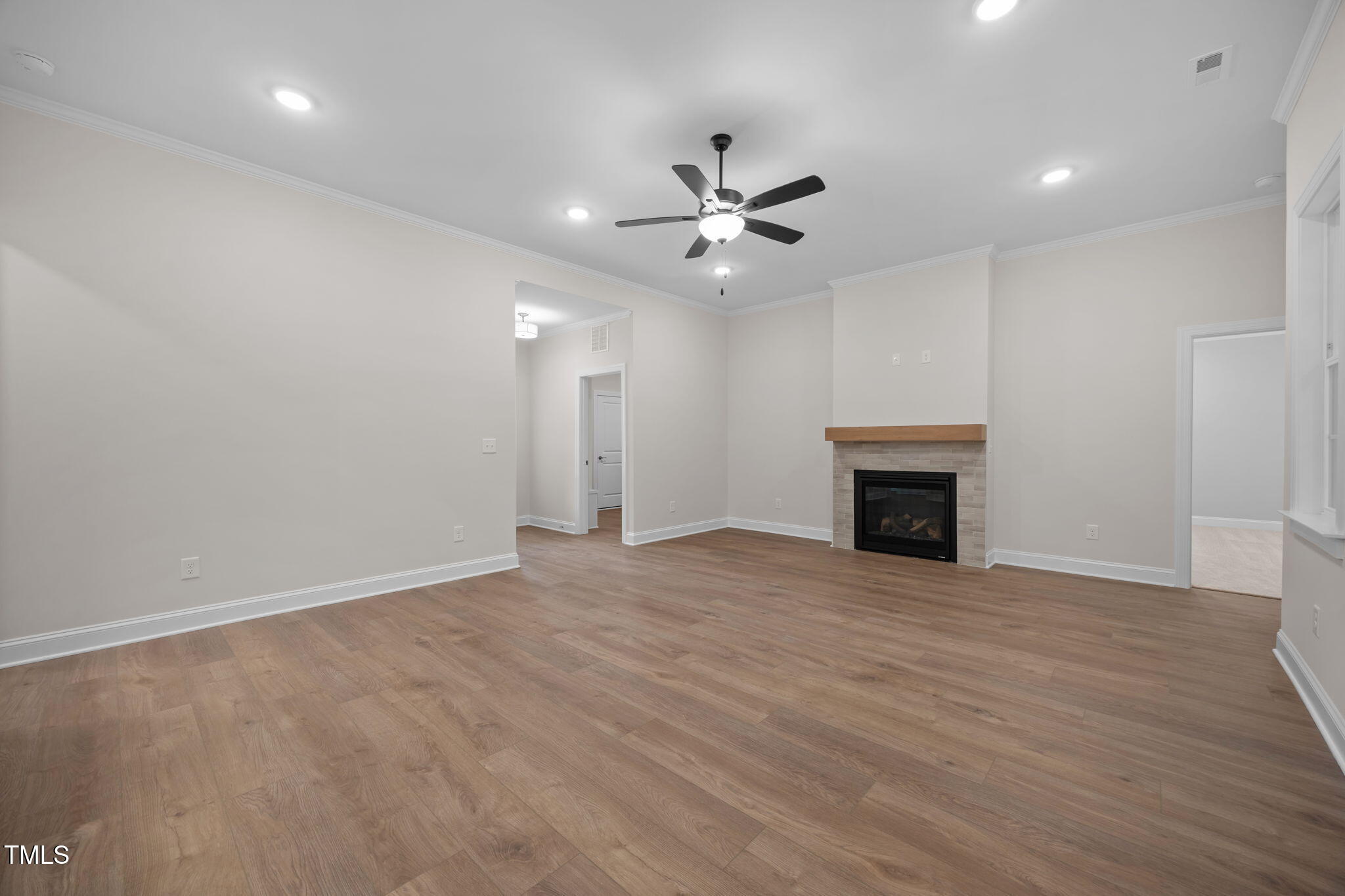 109 Drew Street Louisburg, NC 27549 - Photo 10 of 30 an empty room with fan and windows