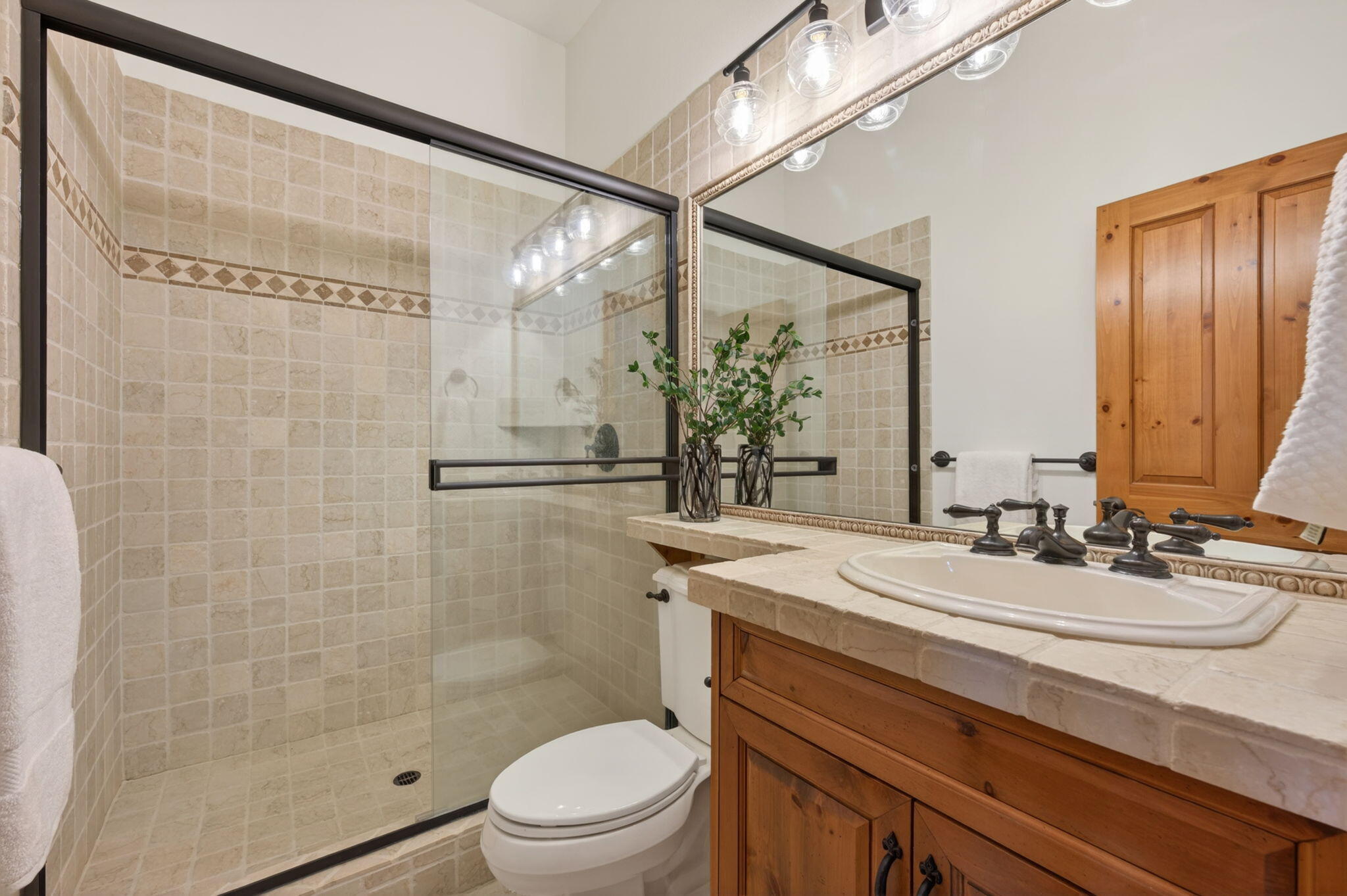 20180 Winston Loop Bend, OR 97703 - Photo 31 of 59 a bathroom with a sink a toilet and shower