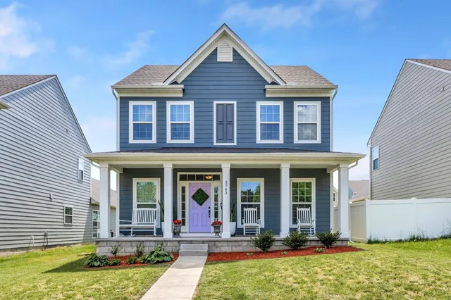 front view of a house with a yard