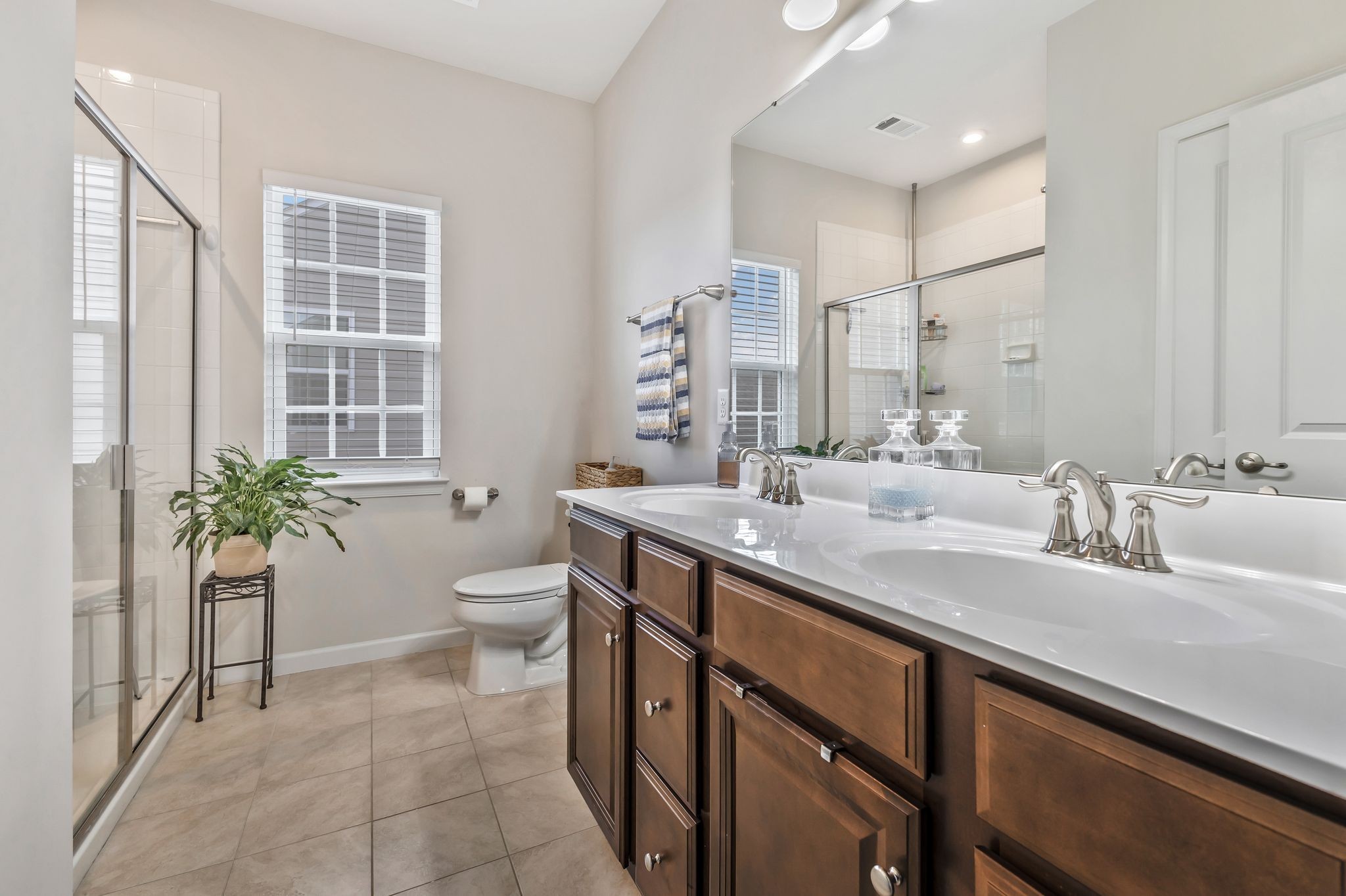3793 Pin Hook Road Antioch, TN 37013 - Photo 13 of 30 a spacious bathroom with a granite countertop sink a toilet a mirror and a shower