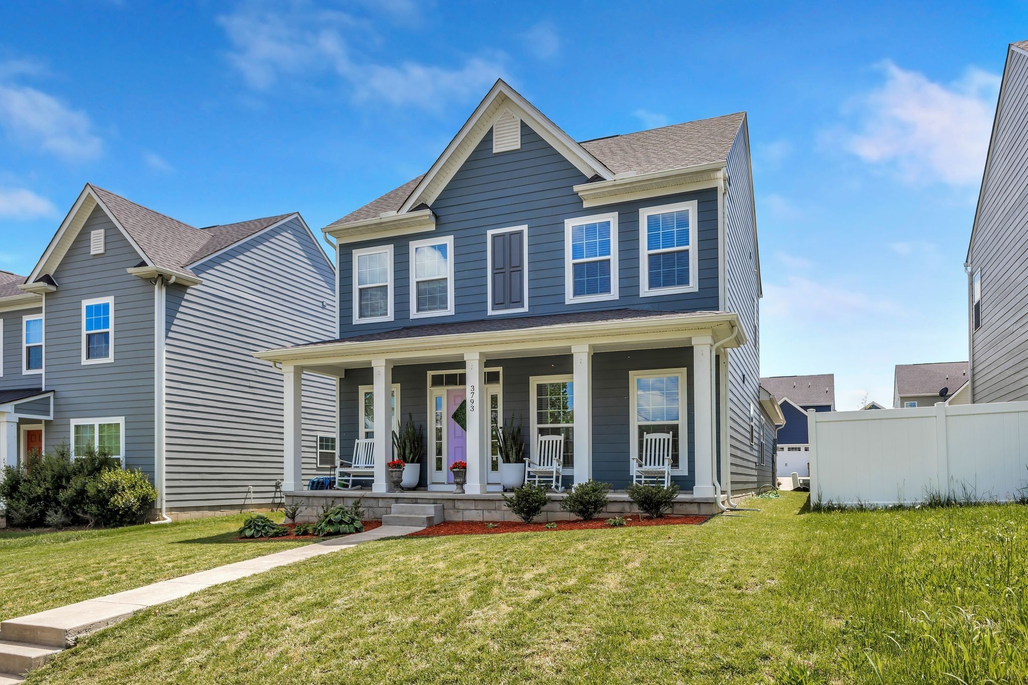 3793 Pin Hook Road Antioch, TN 37013 - Photo 18 of 30 a view of a brick house with a yard potted plants and a table and chairs