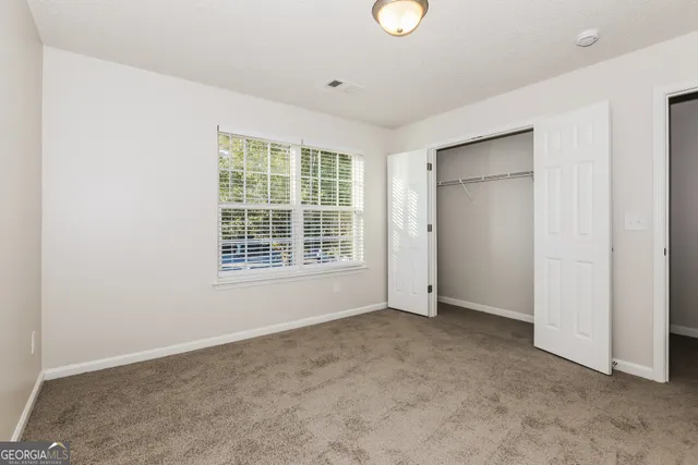 an empty room with windows