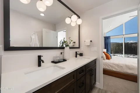 a bedroom with a bed and a walk in closet