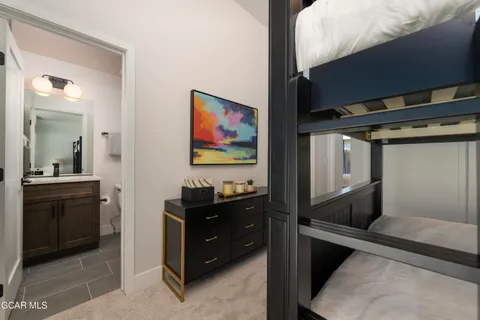 a bedroom with furniture and a window