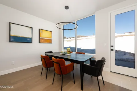 a view of a dining room with furniture and window