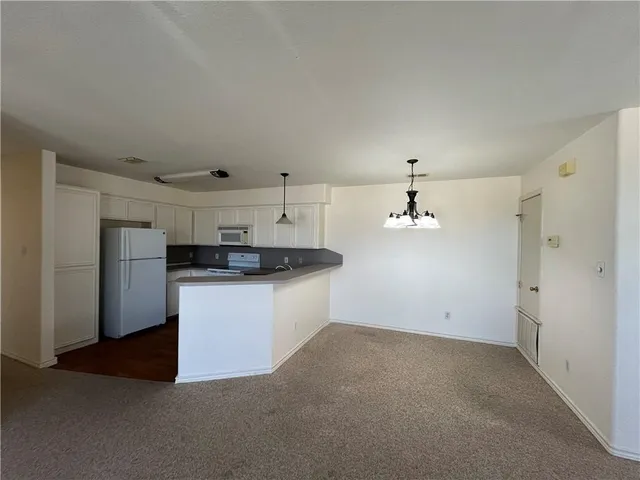 a view of a kitchen with a sink