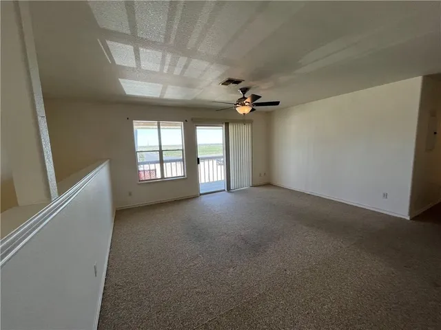 a view of a balcony with wooden floor