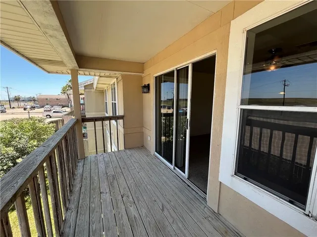 a view of a balcony with chairs