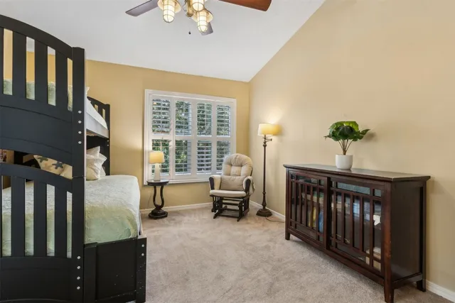 a bedroom with a bed and a couch