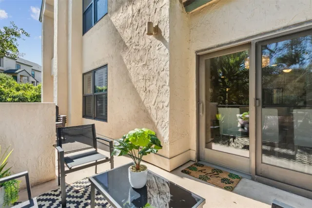 a view of a balcony with chairs