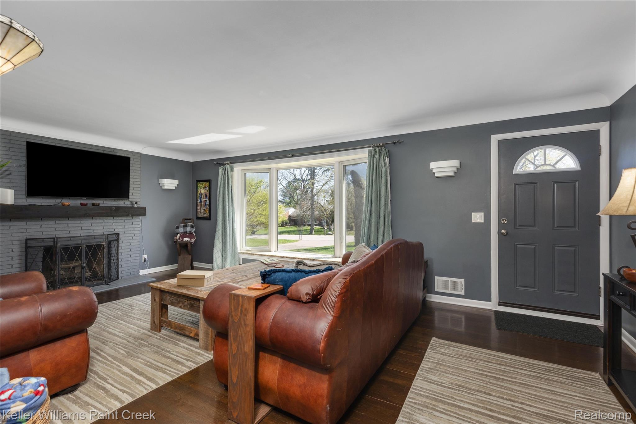 310 Elmhill Road Rochester, MI 48306 - Photo 5 of 37 Living room featuring a fireplace and dark wood-style floors