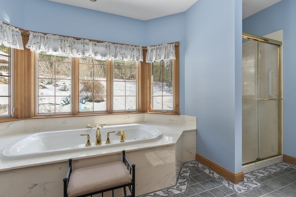 171 Scantic Road Hampden, MA 01036 - Photo 20 of 42 a white bath tub sitting next to a window