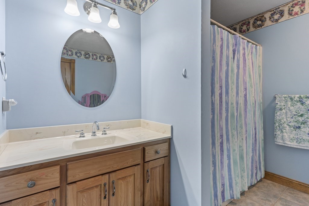 171 Scantic Road Hampden, MA 01036 - Photo 21 of 42 a bathroom with a sink and a mirror