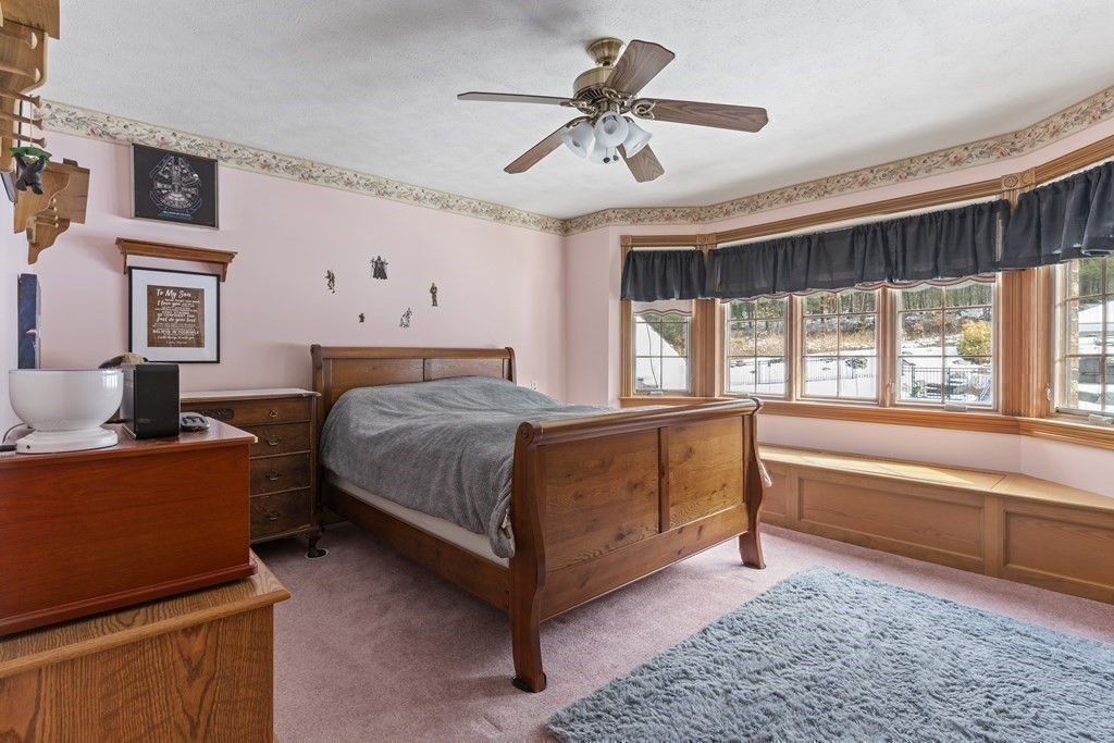 171 Scantic Road Hampden, MA 01036 - Photo 24 of 42 a bedroom with a bed and a large window