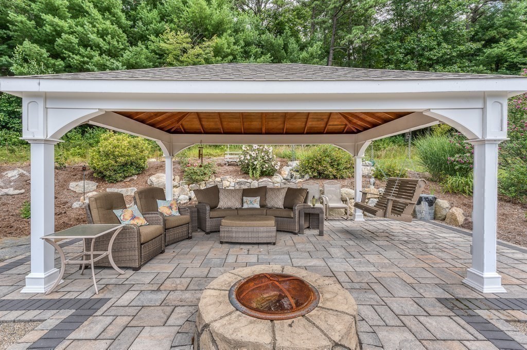 171 Scantic Road Hampden, MA 01036 - Photo 31 of 42 a view of a patio with lawn chairs floor to ceiling window and plants