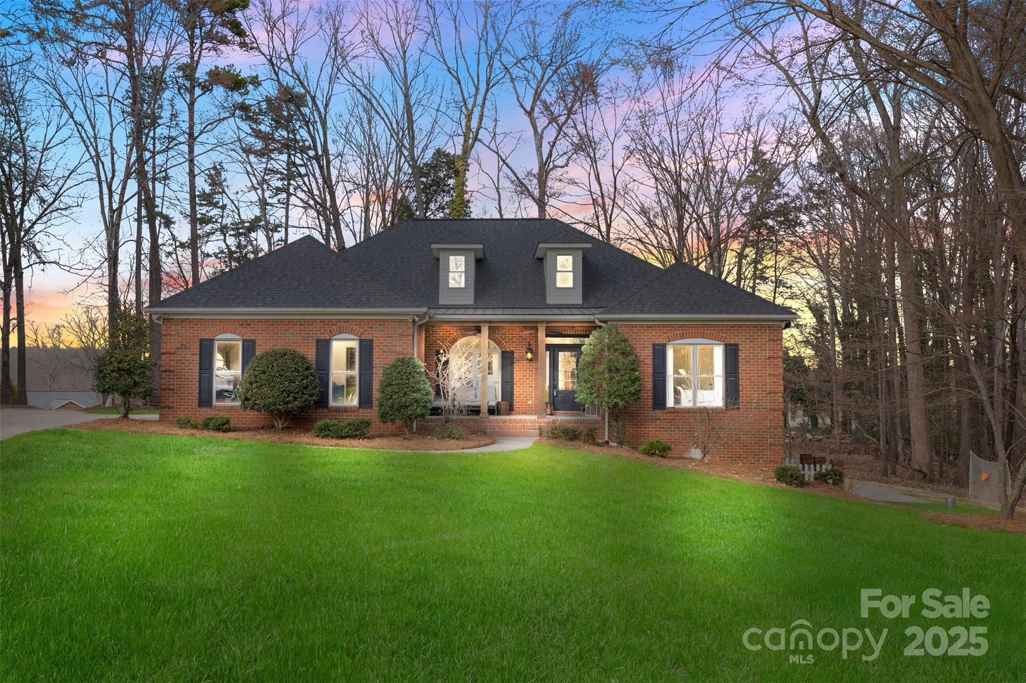 1135 Ben Black Road Midland, NC 28107 - Photo 1 of 38 a front view of a house with a yard and trees