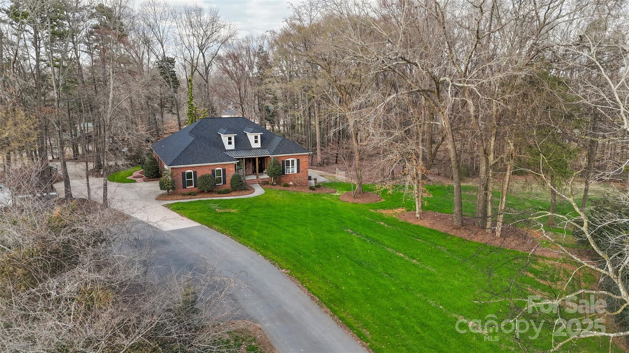 1135 Ben Black Road Midland, NC 28107 - Photo 3 of 38 a view of a large garden with plants and large trees