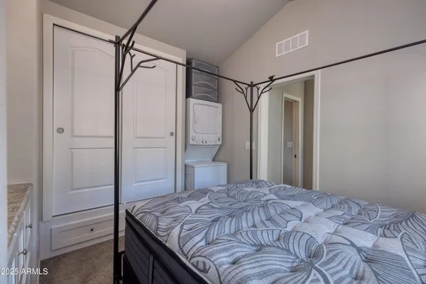 a bedroom with a bed and a shower