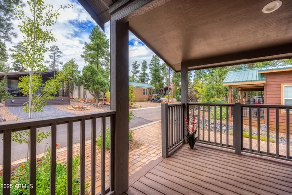 a view of a balcony with wooden floor