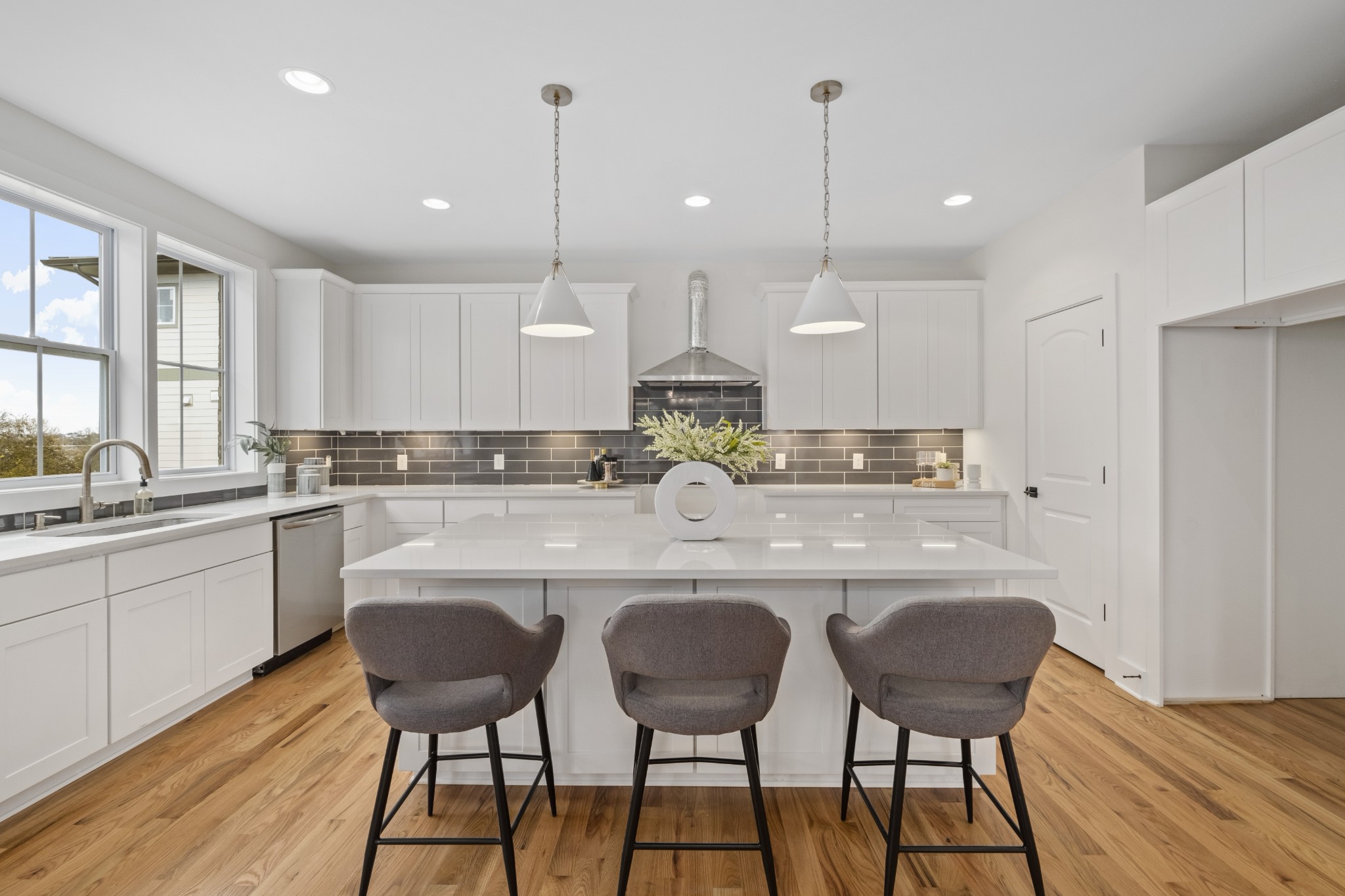 111 Demoss Road Nashville, TN 37209 - Photo 17 of 38 a kitchen with stainless steel appliances granite countertop a dining table chairs sink and cabinets