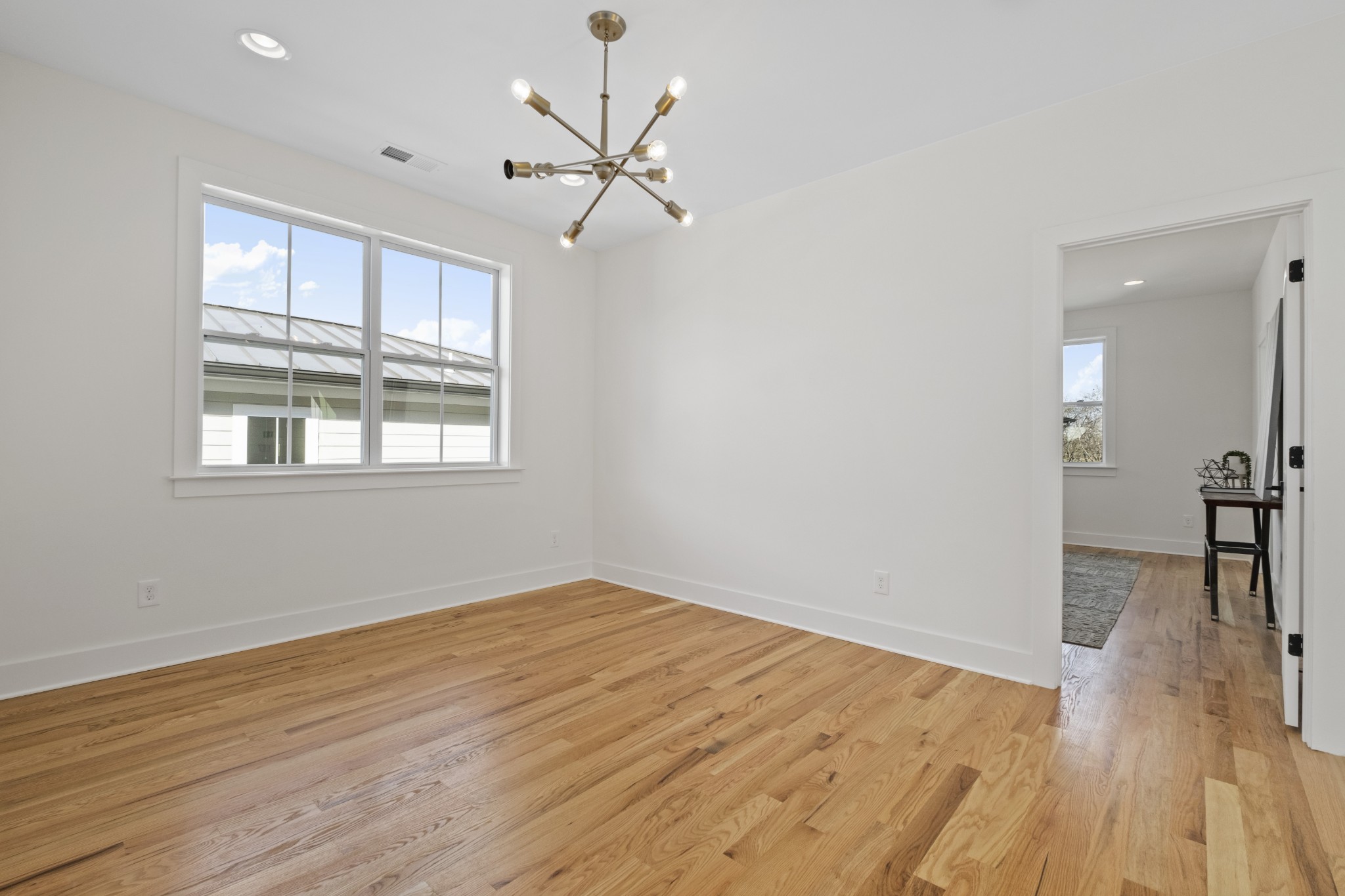 111 Demoss Road Nashville, TN 37209 - Photo 23 of 38 wooden floor in an empty room with a window