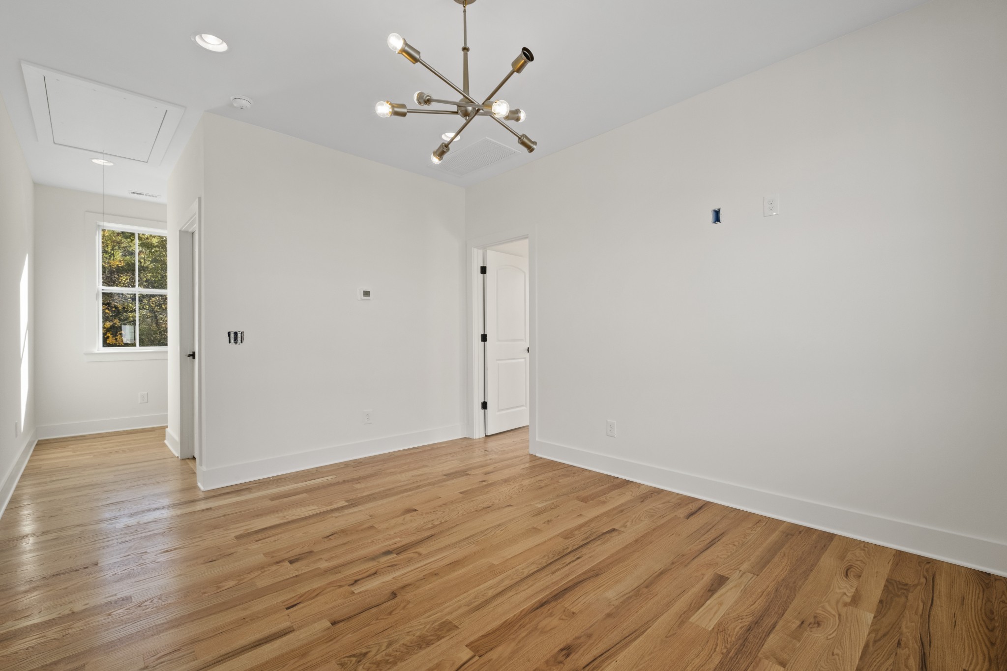 111 Demoss Road Nashville, TN 37209 - Photo 24 of 38 an empty room with wooden floor fan and windows