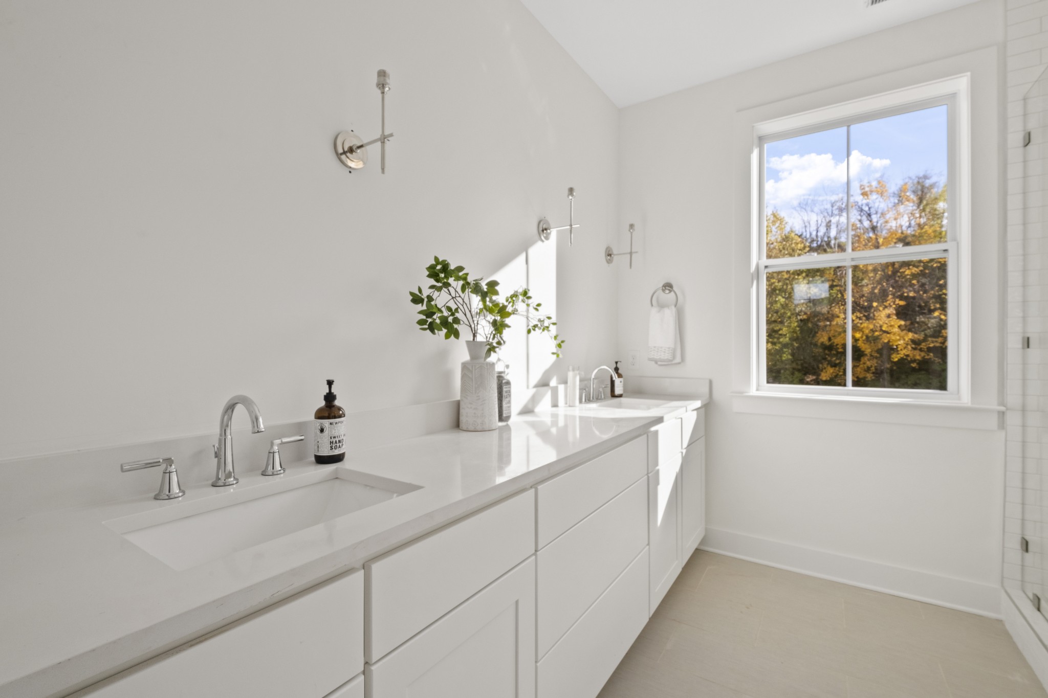 111 Demoss Road Nashville, TN 37209 - Photo 27 of 38 a bathroom with a double vanity sink and a mirror