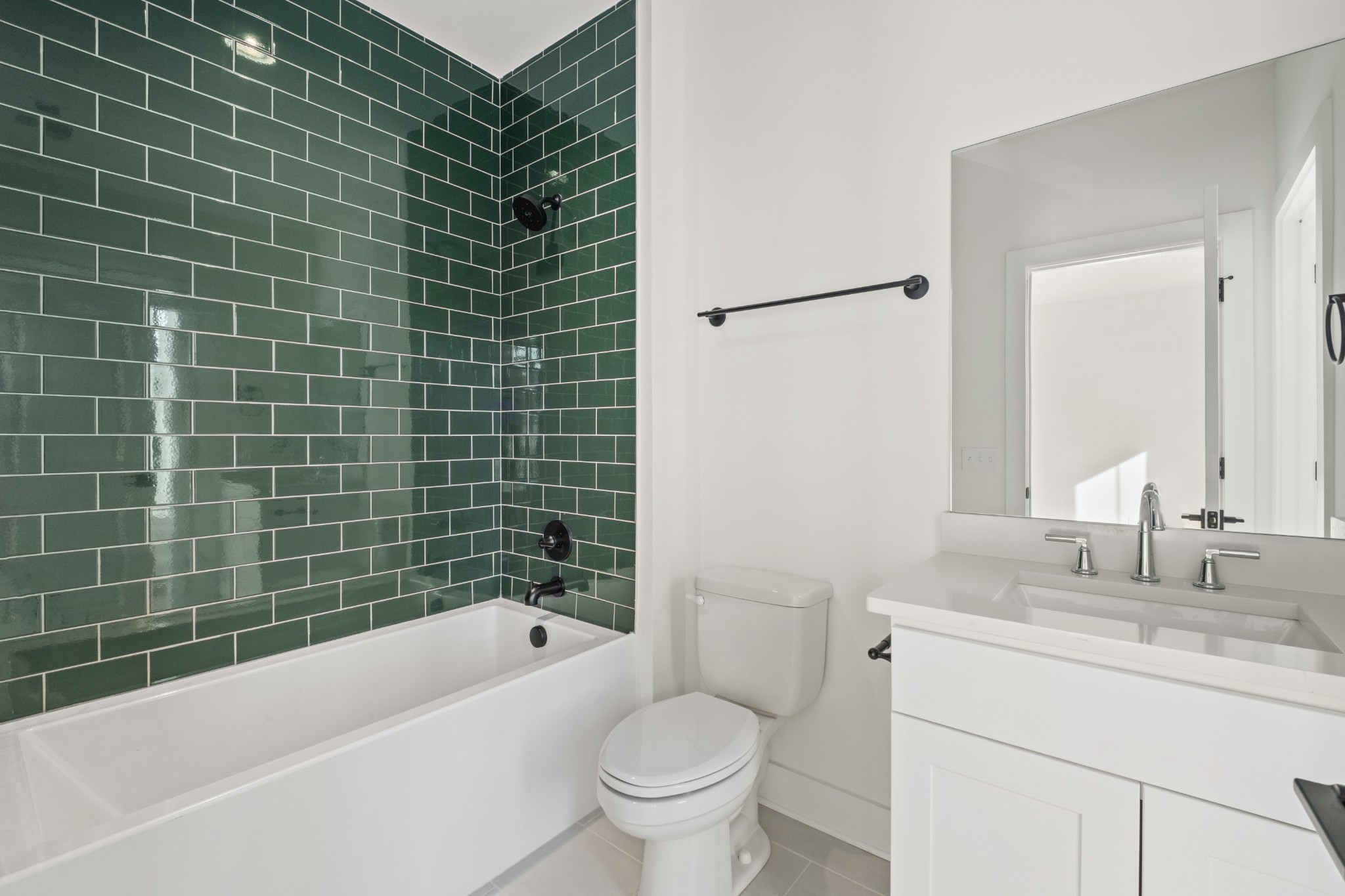 111 Demoss Road Nashville, TN 37209 - Photo 32 of 38 a bathroom with a sink a toilet a mirror a bathtub and shower