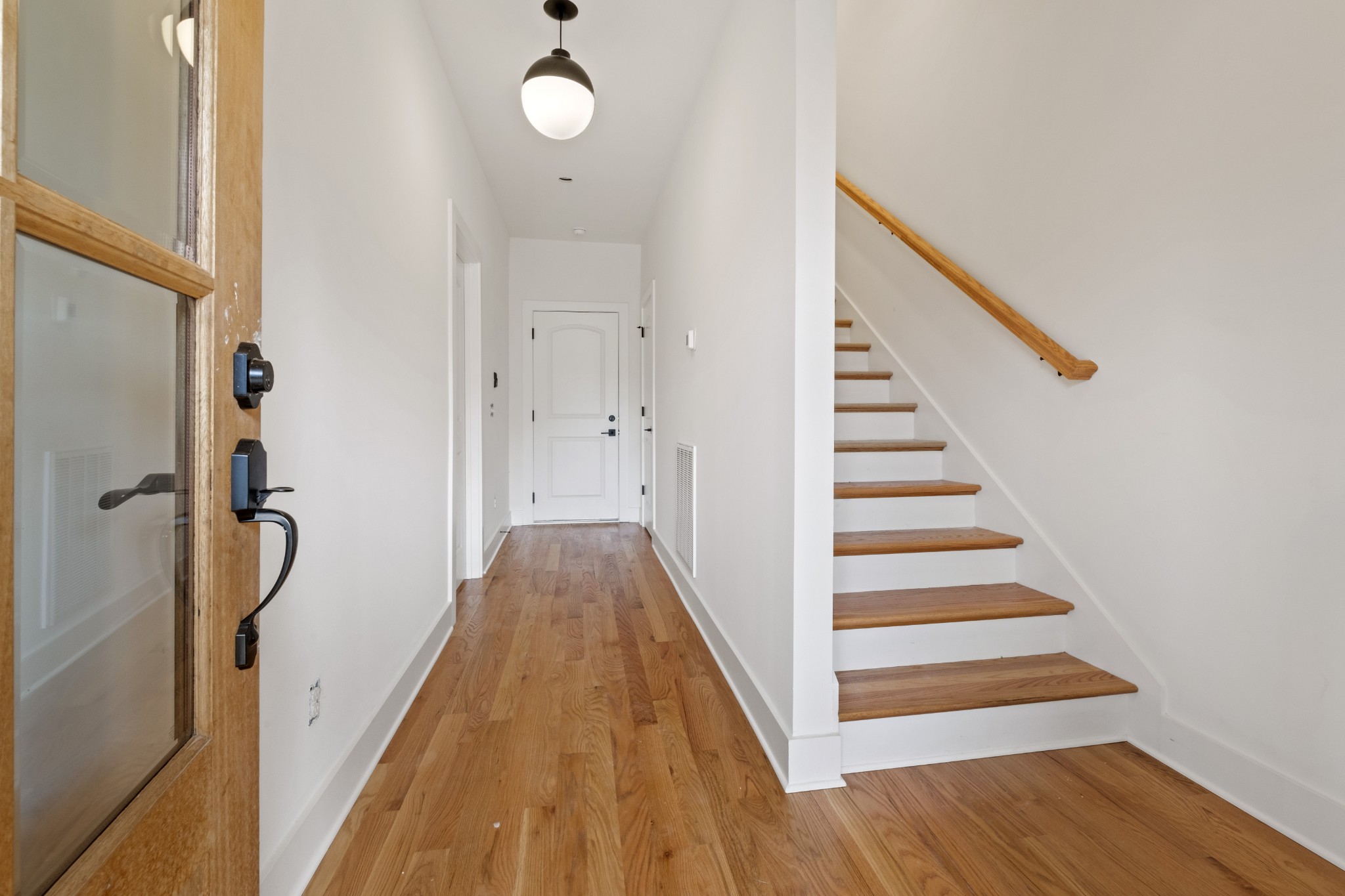 111 Demoss Road Nashville, TN 37209 - Photo 5 of 38 a view of a hallway with wooden floor and staircase