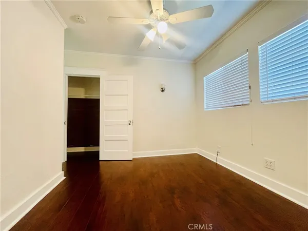 an empty room with wooden floor